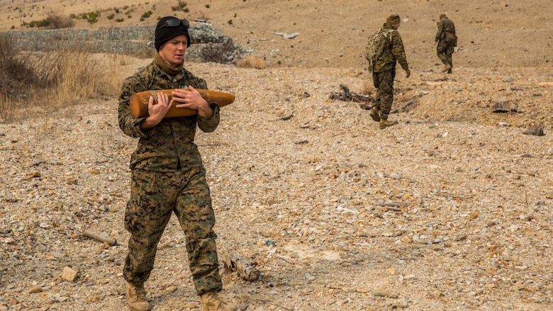 U.S. Marine Sgt. Michael Baker, an explosive ordnance disposal technician with the 13th Marine Expeditionary Unit, carries an undetonated 155 mm round to a consolidation point during Exercise Ssang Yong 16 on Suseongri live-fire range, Pohang, South Korea, March 13, 2016. Ssang Yong is a biennial combined amphibious exercise conducted by U.S. forces with the Republic of Korea Navy and Marine Corps, Australian Army and Royal New Zealand Army Forces in order to strengthen interoperability and working relationships across a wide range of military operations.