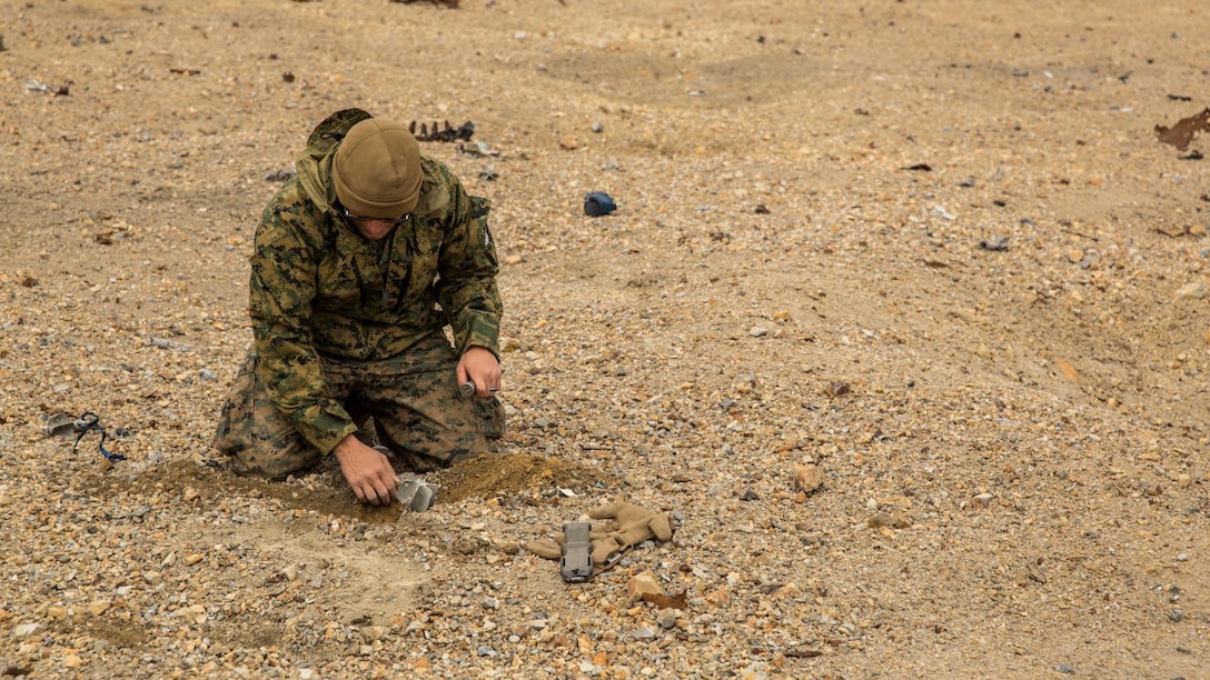 U.S. Marine Sgt. Michael Peck, an explosive ordnance disposal technician with the 13th Marine Expeditionary Unit, digs out a 60 mm round during Exercise Ssang Yong 16 on Suseongri live-fire range, Pohang, South Korea, March 13, 2016. Ssang Yong is a biennial combined amphibious exercise conducted by U.S. forces with the Republic of Korea Navy and Marine Corps, Australian Army and Royal New Zealand Army Forces in order to strengthen interoperability and working relationships across a wide range of military operations.