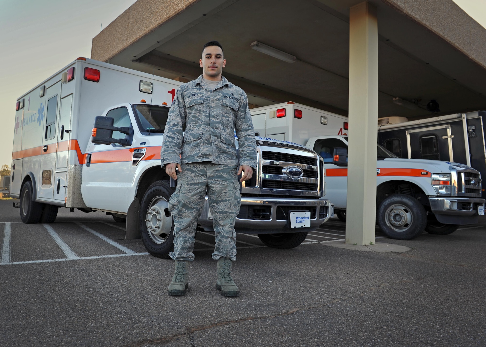 Senior Airman Paul Alkoby, 27th Special Operations Medical Operations Squadron aerospace medical technician, stands just outside the clinic March 2, 2016, at Cannon Air Force Base, N.M. Alkoby has come to the aid of those in need both on and off duty time and time again, solidifying his status as a trusted care hero amongst Air Force medical professionals; he credits his upbringing and the Air Force’s integrity-first mindset for his inability to standby while others are in need. (U.S. Air Force photo/Staff Sgt. Whitney Amstutz)