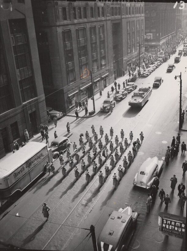 6th War Bond Exhibition, Chicago, IL, Nov 1944. Marching Band of Women Marines led this section of a troop parade, encouraging the purchase of War Bonds during World War II.