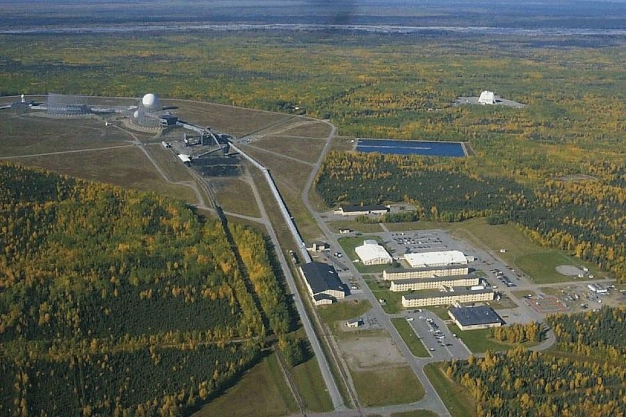 The installation at Clear Air Force Station sprawls over the Alaskan interior. The 11-story tall Solid State Phased Array Radar system is visible at the top right. (Courtesy photo)