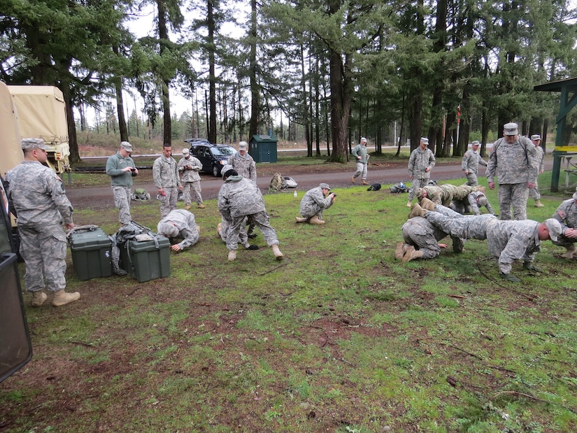 Soldiers in the 364th Sustainment Command (Expeditionary) push themselves through a physical event during the unit's Best Warrior Competition held at JBLM March 2-5.