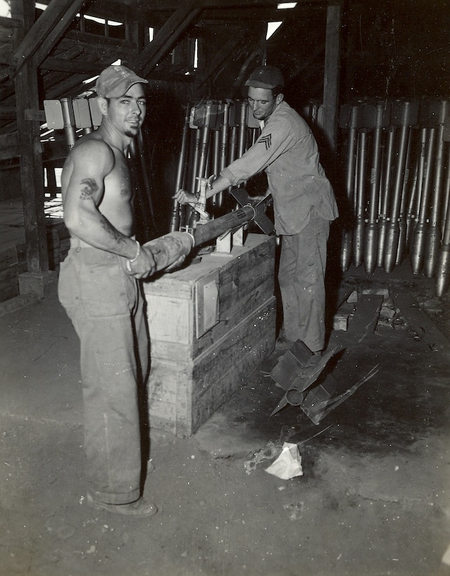 33rd Marine Aircraft Group, Okinawa, Japan, April-May 1945. Preparation of rockets to be mounted on Marine aircraft.