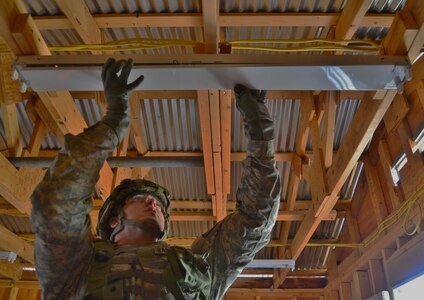 A U.S. Army Reserve Soldier with the 389th Engineer Company (Hortizontal), installs new light fixtures during Combat Support Training Exercise 78-16-01 at Fort Hunter Liggett, Calif. Nearly 40 units from the U.S. Army Reserve, U.S. Air Force and Canadian Armed Forces trained at Joint Base McGuire-Dix-Lakehurst, N.J., Fort Knox, Ky. and Fort Hunter Liggett, Calif., as part of the 84th Training Command's CSTX 78-16-01. This exercise marks the first CSTX of 2016 and is hosted by the 78th Training Division. (U.S. Army photo by Sgt. Steffanie Collazo)