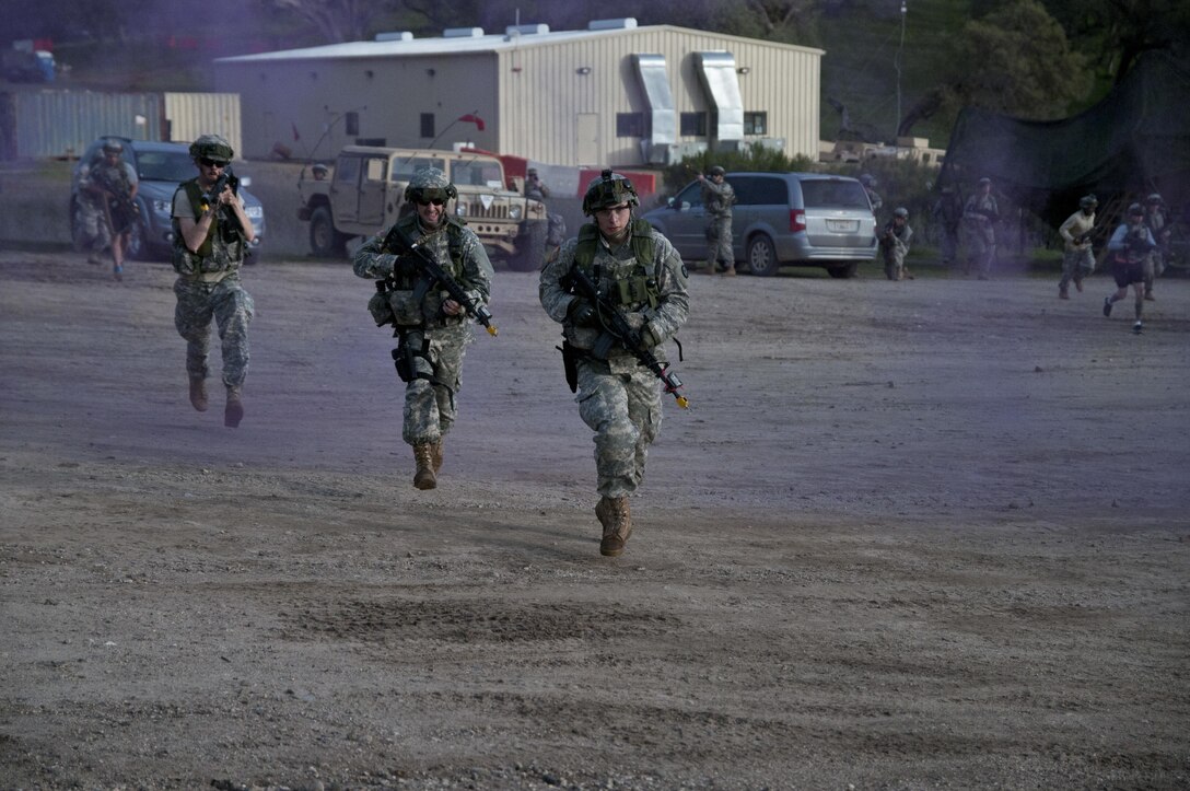 U.S. Army Reserve Soldiers react to contact during Combat Support Training Exercise 78-16-01 at Fort Hunter Liggett, Calif. Nearly 40 units from the U.S. Army Reserve, U.S. Air Force and Canadian Armed Forces trained at Joint Base McGuire-Dix-Lakehurst, N.J., Fort Knox, Ky. and Fort Hunter Liggett, Calif., as part of the 84th Training Command's CSTX 78-16-01. This exercise marks the first CSTX of 2016 and is hosted by the 78th Training Division. (U.S. Army photo by Staff Sgt. Debralee Best)