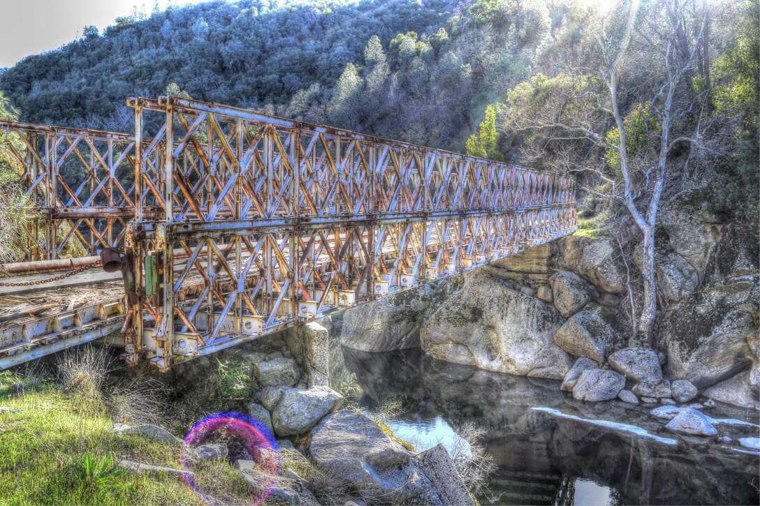 The Bailey Bridge on Fort Hunter Liggett, Calif., was surveyed by the 650th Survey and Design Team and the 368th Engineer Battalion construction management team during Combat Support Training Exercise 78-16-01. Nearly 40 units from the U.S. Army Reserve, U.S. Air Force and Canadian Armed Forces trained at Joint Base McGuire-Dix-Lakehurst, N.J., Fort Knox, Ky., and Fort Hunter Liggett, Calif., as part of the 84th Training Command's CSTX 78-16-01. This exercise marks the first CSTX of 2016 and is hosted by the 78th Training Division. (U.S. Army photo illustration by Command Sgt. Maj. Stephen Bodwell)