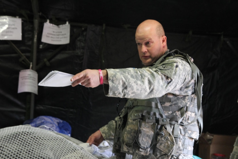 U.S. Army Sgt. James Peterson, a shower/laundry and clothing repair specialist assigned to the 1008th Quartermaster Company, instructs Soldiers to sort laundry in support of the Combat Support Training Exercise (CSTX) “Arctic Lightning” at Joint Base McGuire-Dix-Lakehurst, N.J., March 13, 2016. The 1008th Quartermaster Company supports other units participating in the 21-day exercise by providing fresh laundry and hot showers at the various training sites.