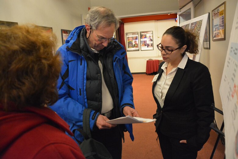 Erica Labeste, real estate specialist, U.S. Army Corps of Engineers, New York District, provides a resident with real estate information pertaining to the tentatively selected plan for the Mamaroneck and Sheldrake Rivers Basin Flood Risk Management Study. The U.S. Army Corps of Engineers, in partnership with  New York State Department of Environmental Conservation, Westchester County, and Village of Mamaroneck held a Public Information Meeting, Mamaroneck, N.Y., February 25, 2016. The public meeting  inform the community  of Mamoroneck about the proposed alternative plan selected for the Mamaroneck and Sheldrake Rivers Basin Flood Risk Management Project.(photo by: Hector Mosley, public affairs specialist, New York District)