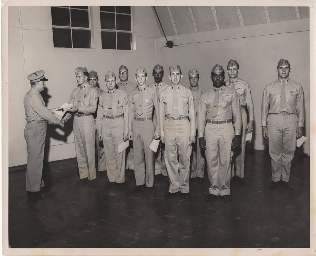 61st Special Marine Infantry Company, Lexington, KY, 1954. These Reserve Marines are recognized for their exceptional marksmanship skills by receiving their expert pistol marksmanship badges and certificates. 