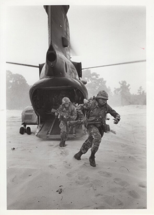 3rd Battalion, 24th Marine Regiment, 1976. These Reserve Marines rush out the ramp of a CH-46 helicopter during a helicopter-insertion exercise during Operation Bonded Item. This operation was a major NATO exercise involving several military contingents.