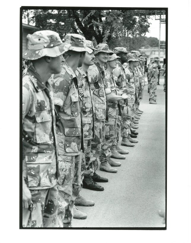 14th Marine Regiment, 1991. These Reserve Marines standby in their last formation before being dismissed to join their families to celebrate their homecoming from the Gulf War.