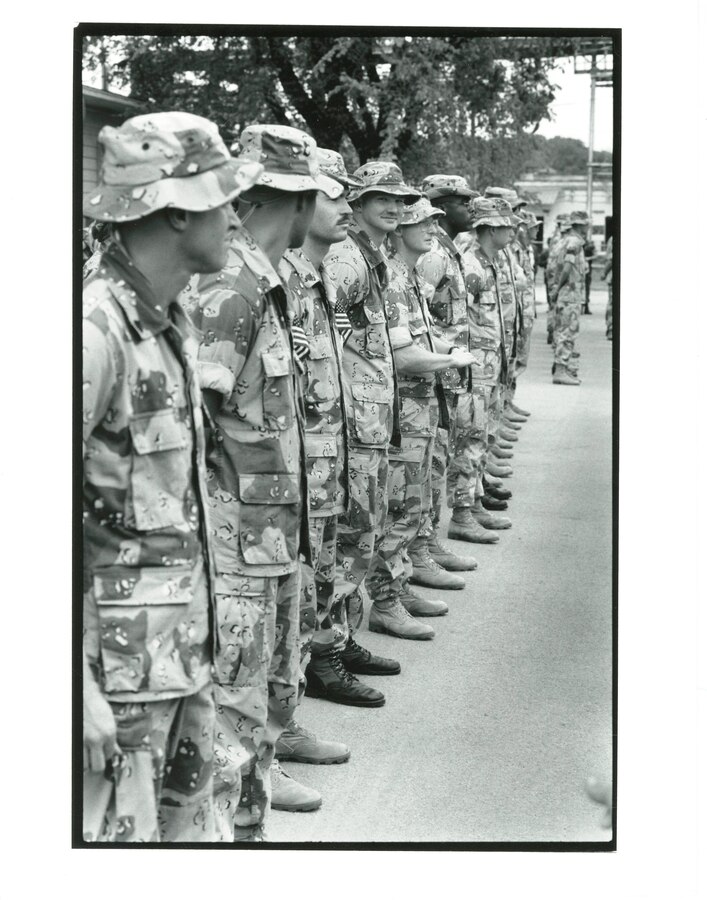 14th Marine Regiment, 1991. These Reserve Marines standby in their last formation before being dismissed to join their families to celebrate their homecoming from the Gulf War.