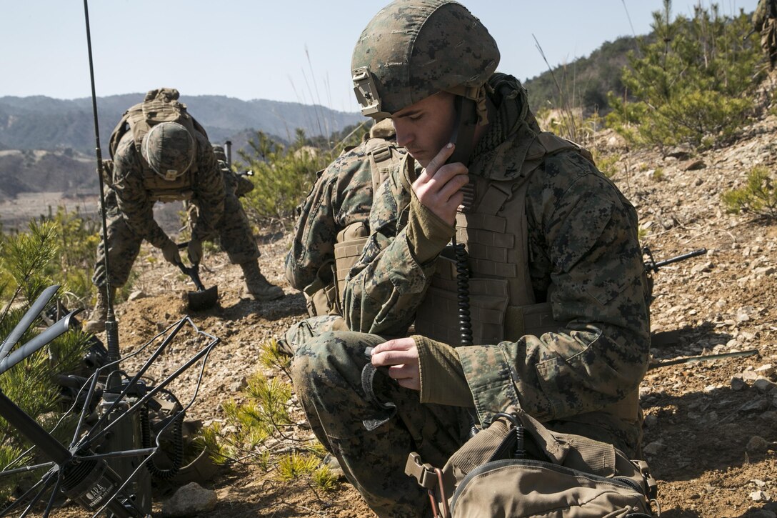 Marine Corps Lance Cpl. Andrew Straughan sets up communications during Exercise Ssang Yong 2016 in Pohang, South Korea, March 11, 2016. Marine Corps photo by Sgt. Briauna Birl