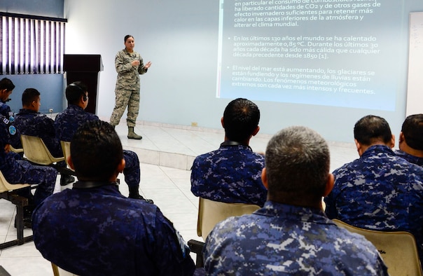 U.S. Air Force Staff Sgt. Karina Cortes, 628th Medical Operations Squadron medical technician, briefs a group of Salvadoran air force members on how weather can affect an individual’s health during a medical subject matter expert exchange at Ilopango Air Base, El Salvador, March 9, 2016. 12th Air Force (Air Forces Southern) surgeon general’s office, led a five-member team of medics from around the U.S. Air Force on a week-long medical subject matter expert exchange in El Salvador. (U.S. Air Force photo by Tech. Sgt. Heather R. Redman/Released)