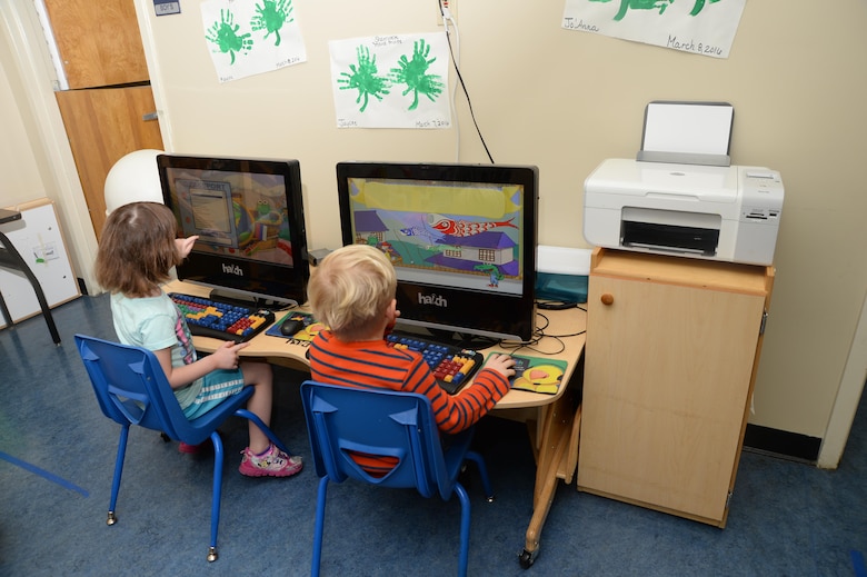 Children log-on and play games using a computer system while at the Pre-K Child Development Center recently. The students learned to navigate computer systems while playing games on the equipment.
