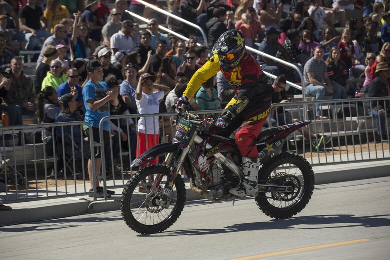 Jimmy Fitzpatrick, freestyle motocross rider, Metal Mulisha, performs stunts at the Motocross Jam Fest aboard the Combat Center March 12, 2016. The event, hosted by Marine Corps Community Services, included concession stands, motorcycle stunt performances by professional motocross riders, and live rock music from Boston-based band, Lansdowne. (Official Marine Corps photo by Lance Cpl. Levi Schultz/Released)