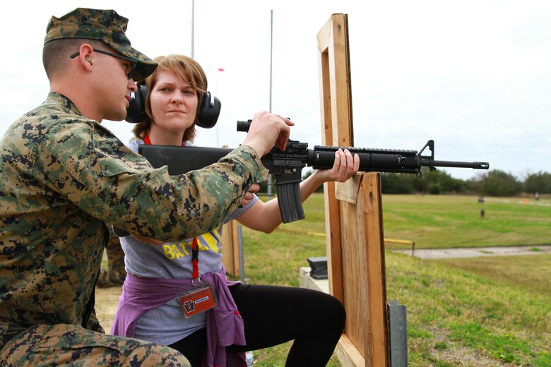 Amy Gehring, an educator at Upper Dauphin High School, receives tips on how to shoot her M-16A4 rifle during an Educators’ Workshop at Marine Corps Recruit Depot Parris Island, S.C., March 9, 2016. The Marine Corps invited teachers from New York, Pennsylvania and Vermont to experience how Marines are made at the depot. The educators were given the opportunity to shoot the same weapon as recruits and were accompanied by Marine Corps marksmanship instructors. (U.S. Marine Corps photo by Cpl. Brandon Thomas/released)