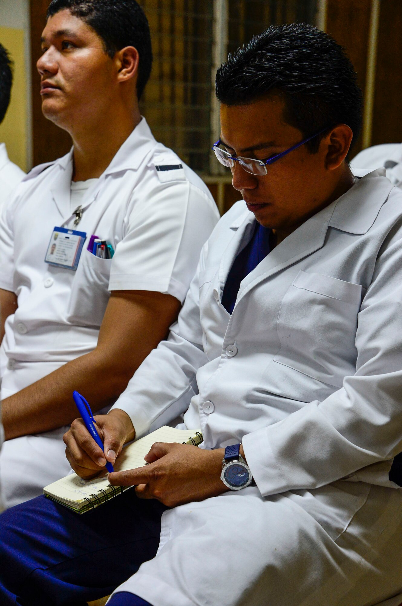 A medical technician in training at Hospital Militar de El Salvador takes notes during a briefing on first responder procedures given by U.S. Air Force Maj. Helda Carey, 12th Air Force (Air Forces Southern) international health specialist, during a medical subject matter expert exchange in San Salvador, El Salvador, March 11, 2016.  Earlier in the week, Carey led a team of Air Force medical professionals in a week-long exchange with Salvadoran medics at Ilopango Air Base.  After the subject matter expert exchange was completed, the team was invited to a share their expertise with members of the Hospital Militar de El Salvador.  (U.S. Air Force photo by Tech. Sgt. Heather R. Redman/Released)
