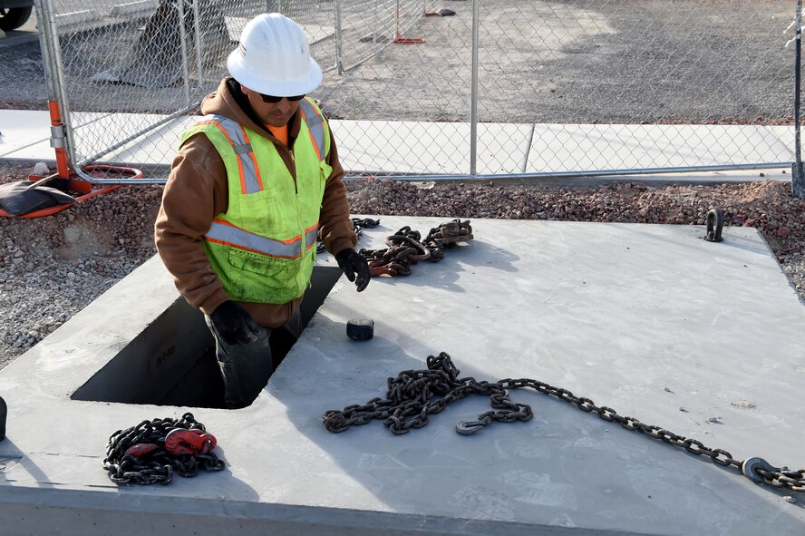 Construction workers prep an area to build a new structure March 15, 2016 at Creech Air Force Base, Nevada. Airmen from the 432nd Wing/432nd Air Expeditionary Wing will soon have a new building to house the Human Performance Team. The HPT is unique to Creech AFB and is comprised of the chaplain corps, operational psychologist, operational physiologist, and flight medicine doctor and aims to help Airmen in the spiritual, psychological, physical, emotional, and intellectual areas of wellness. (U.S. Air Force photo by Senior Airman Adarius Petty/Released)