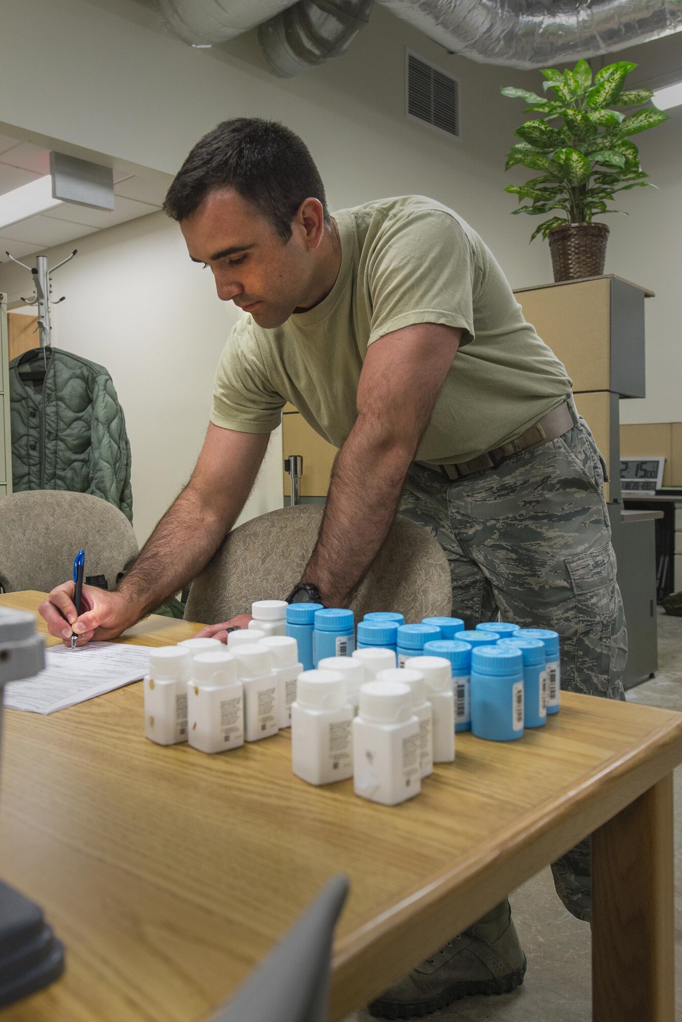 U.S. Air Force Senior Airman Tray Guillory, 23d Medical Support Squadron logistics customer service representative, reviews the quantity and quality of prescription medicine, March 15, 2016, at Moody Air Force Base, Ga. Medical logistics ensures pharmaceuticals and medical supplies are safe to use by checking manufacturer recalls and expiration dates. (U.S. Air Force photo by Airman Daniel Snider/Released) 
