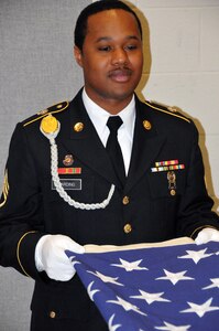 Staff Sgt. Paul Harding, assigned to the U.S. Army Reserve's 78th Army Band at the 99th Regional Support Command at Joint Base McGuire-Dix-Lakehurst, New Jersey, practices folding the Flag during Military Funeral Honors Training March 15.