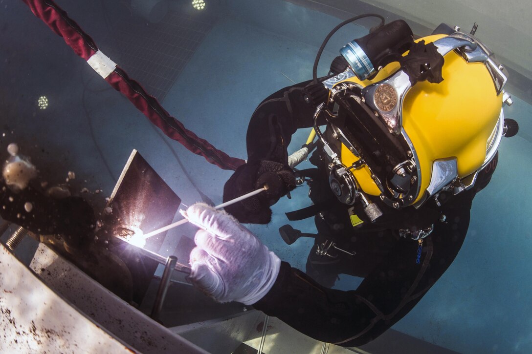Navy Petty Officer 2nd Class Jesus Saucedo Gomez performs an underwater fillet weld in a training pool at the South Korean engineering school during exercise Foal Eagle 2016 in Jinhae, South Korea, March 15, 2016. The annual training exercise enhances the readiness of U.S. and South Korean forces, and their ability to work together during a crisis. Gomez is assigned to Underwater Construction Team 2. U.S. Navy photo by Petty Oficer 1st Class Charles E. White
