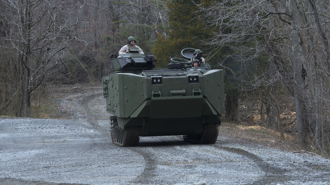 Marines give civilian media a ride in the inside the Amphibious Assault Vehicle Survivability Upgrade at Marine Corps Base Quantico, Va., March 15, 2016. The AAV SU, or amphibious assault vehicle survivability upgrade, will build upon the existing hull. The upgrades include additional armor, blast-mitigating seats and spall liners. They may also include fuel tank protection and automotive and suspension upgrades to keep both land and sea mobility regardless of the added weight.