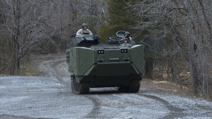 Marines give civilian media a ride in the inside the Amphibious Assault Vehicle Survivability Upgrade at Marine Corps Base Quantico, Va., March 15, 2016. The AAV SU, or amphibious assault vehicle survivability upgrade, will build upon the existing hull. The upgrades include additional armor, blast-mitigating seats and spall liners. They may also include fuel tank protection and automotive and suspension upgrades to keep both land and sea mobility regardless of the added weight.