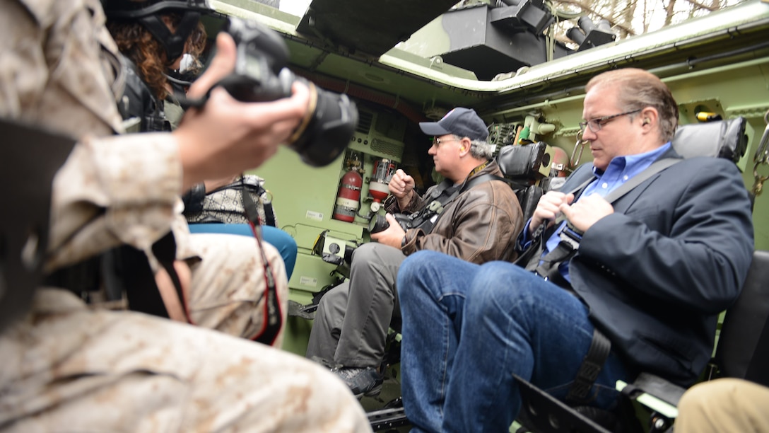 Civilian media are given the opportunity to ride inside the Amphibious Assault Vehicle Survivability Upgrade at Marine Corps Base Quantico, Va., March 15, 2016. The AAV SU, or amphibious assault vehicle survivability upgrade, will build upon the existing hull. The upgrades include additional armor, blast-mitigating seats and spall liners. They may also include fuel tank protection and automotive and suspension upgrades to keep both land and sea mobility regardless of the added weight.