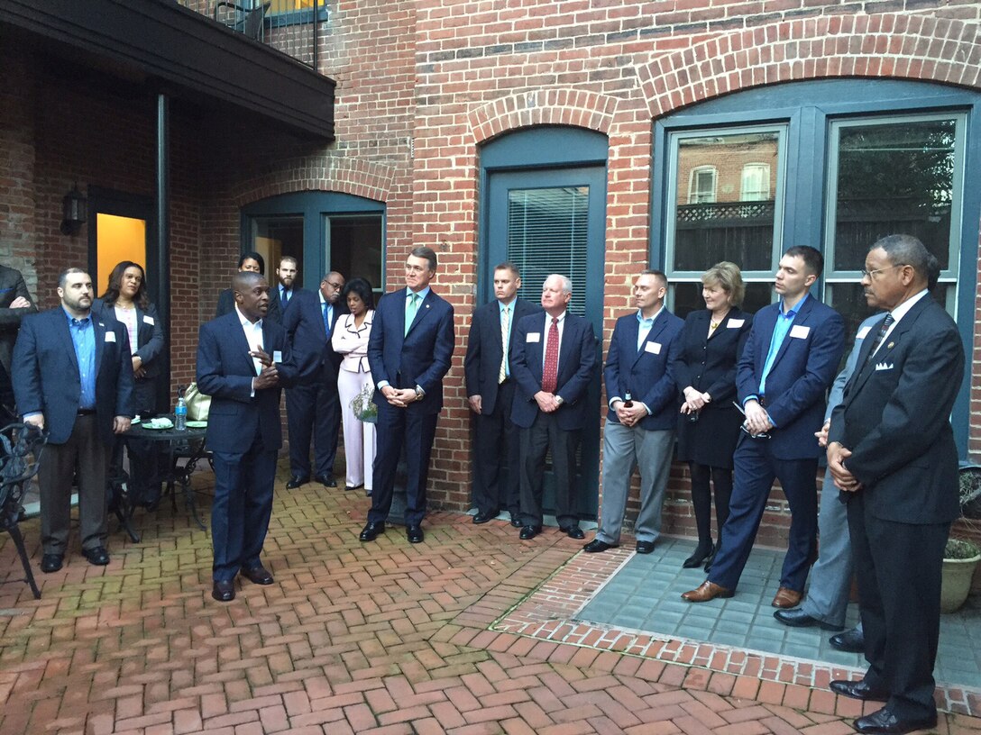 Colonel James C. Carroll III, commanding officer, Marine Corps Logistics Base Albany, addresses a gathering of military, congressional, civilian-Marine and the Albany-Dougherty delegation during a reception at Cornerstone Government Affairs, Washington, D.C., March 15.
