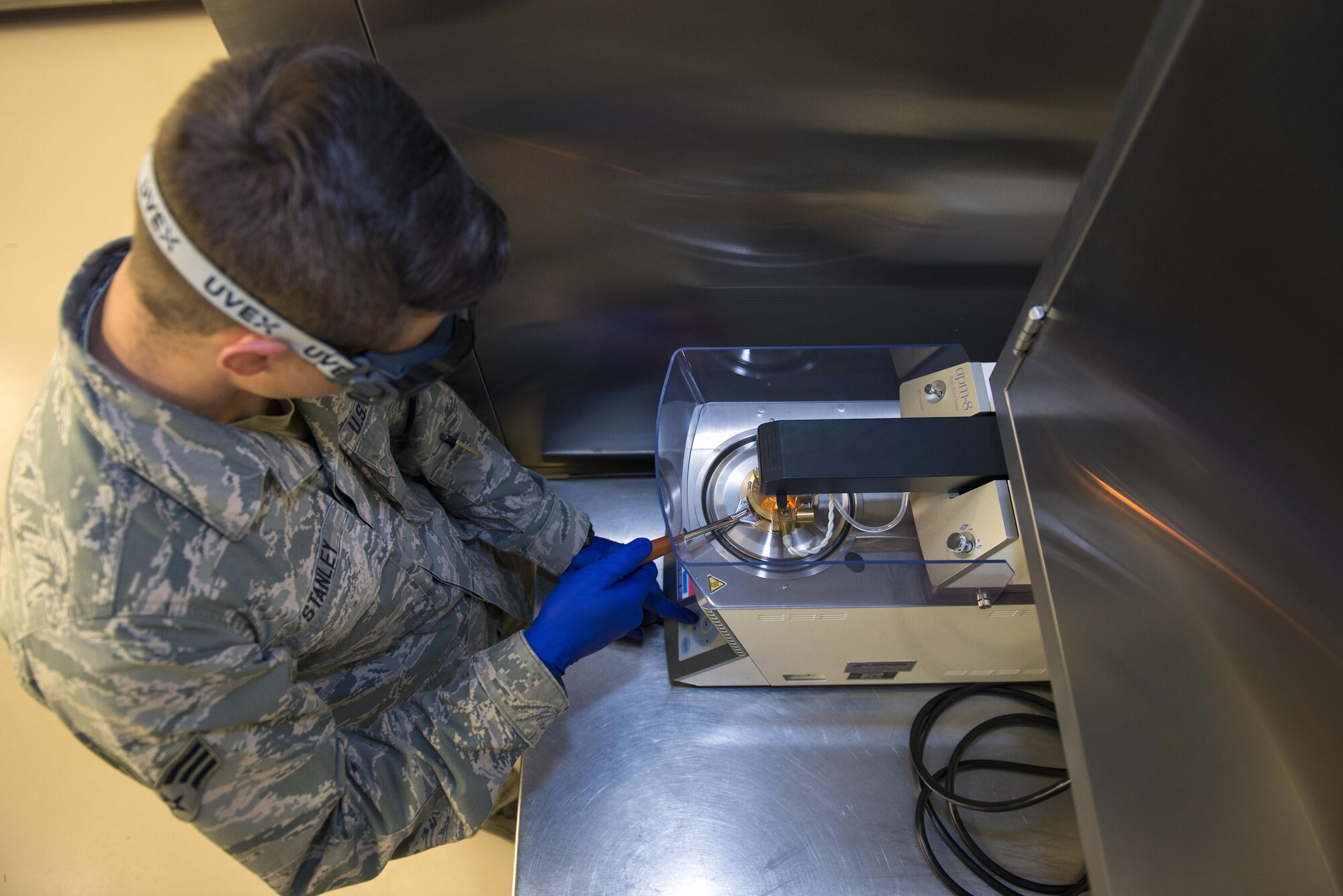 U.S. Air Force Senior Airman Zachary Stanley, 23d Logistics Readiness Squadron fuels laboratory technician, conducts a flashpoint method during fuels sample testing, March 16, 2016, at Moody Air Force Base, Ga. The method measures the fuels response to heat and ignition for fire risk assessment to ensure safety during flight. (U.S. Air Force photo by Airman 1st Class Greg Nash/Released)
