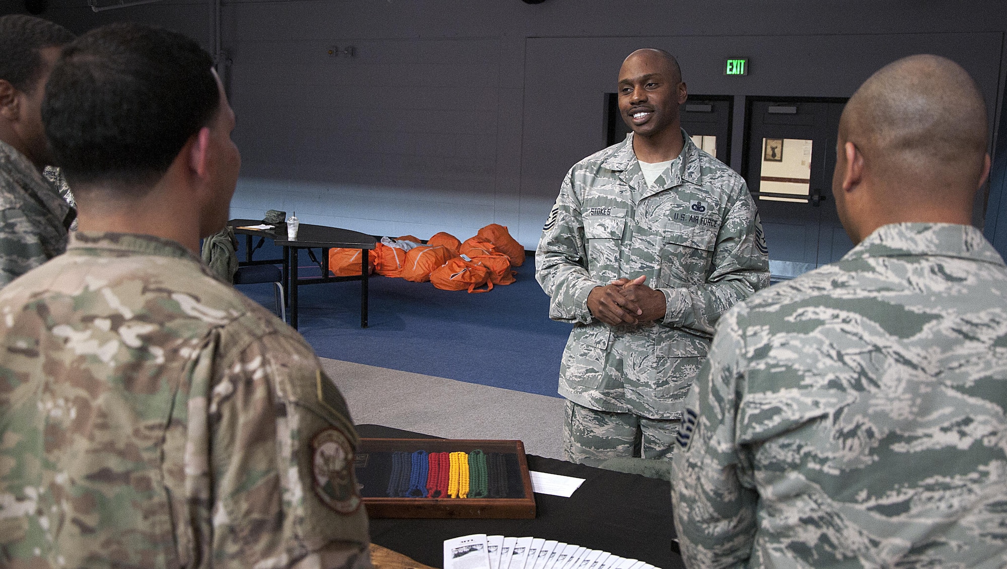 Chief Master Sgt. Christopher Stokes, 90th Security Forces Squadron first sergeant, speaks with Airmen about the qualifications to become a military training leader March 16, 2016, during a Developmental Special Duty job fair in the Fall Hall Community Center on F.E. Warren Air Force Base, Wyo. Representatives who had experiences in eight different DSD careers set up booths to speak with Airmen on what their career did and what qualifications were needed. (U.S. Air Force photo by Senior Airman Brandon Valle)