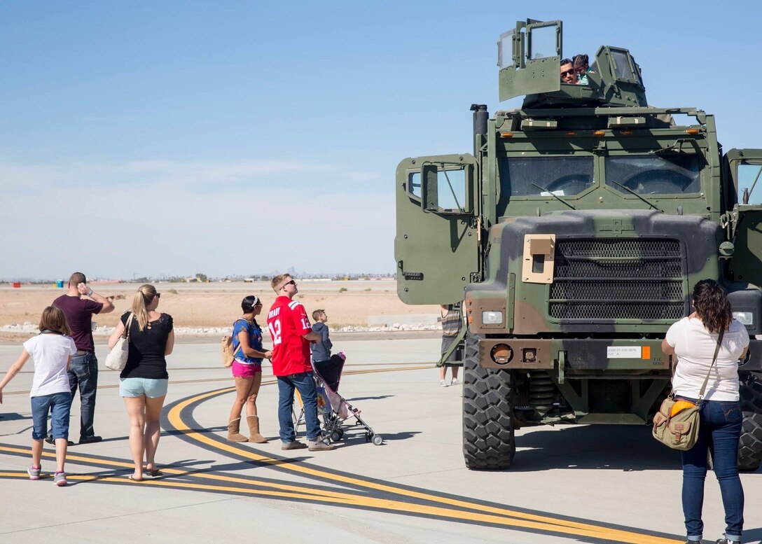 Spectators get an up-close look at military static display aircraft and vehicles during the Yuma Patriot Festival at Marine Corps Air Station Yuma, Ariz., Saturday, Feb. 27, 2016.