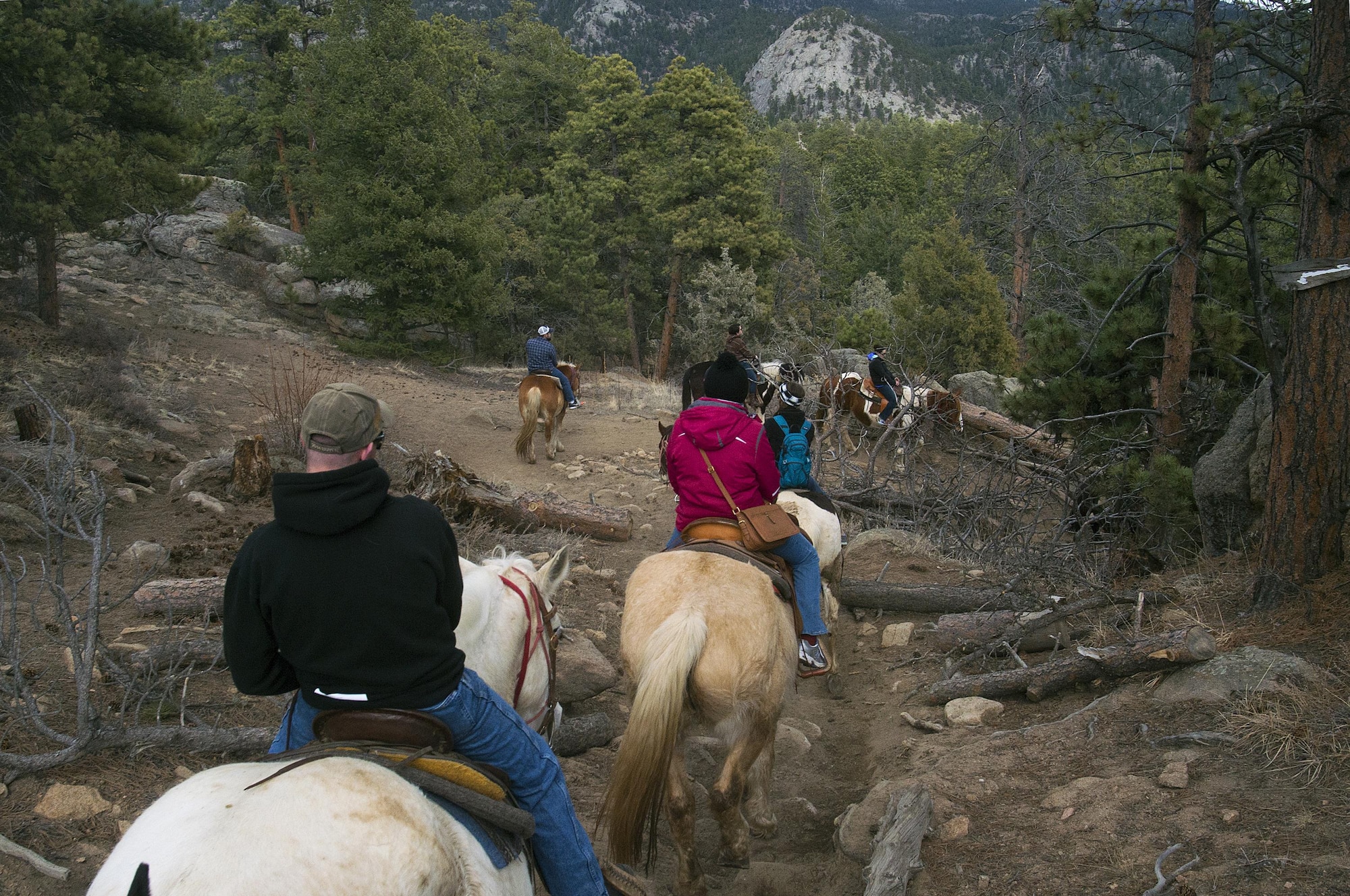 Airmen, retirees and dependents from F.E. Warren Air Force Base, Wyo., ride their mounts down a rocky hillside in the Arapaho-Roosevelt National Forest, Colo., March 13, 2016. The group was part of one of several trips the base’s Outdoor Recreation office offers each year. (U.S. Air Force photo by R.J. Oriez)