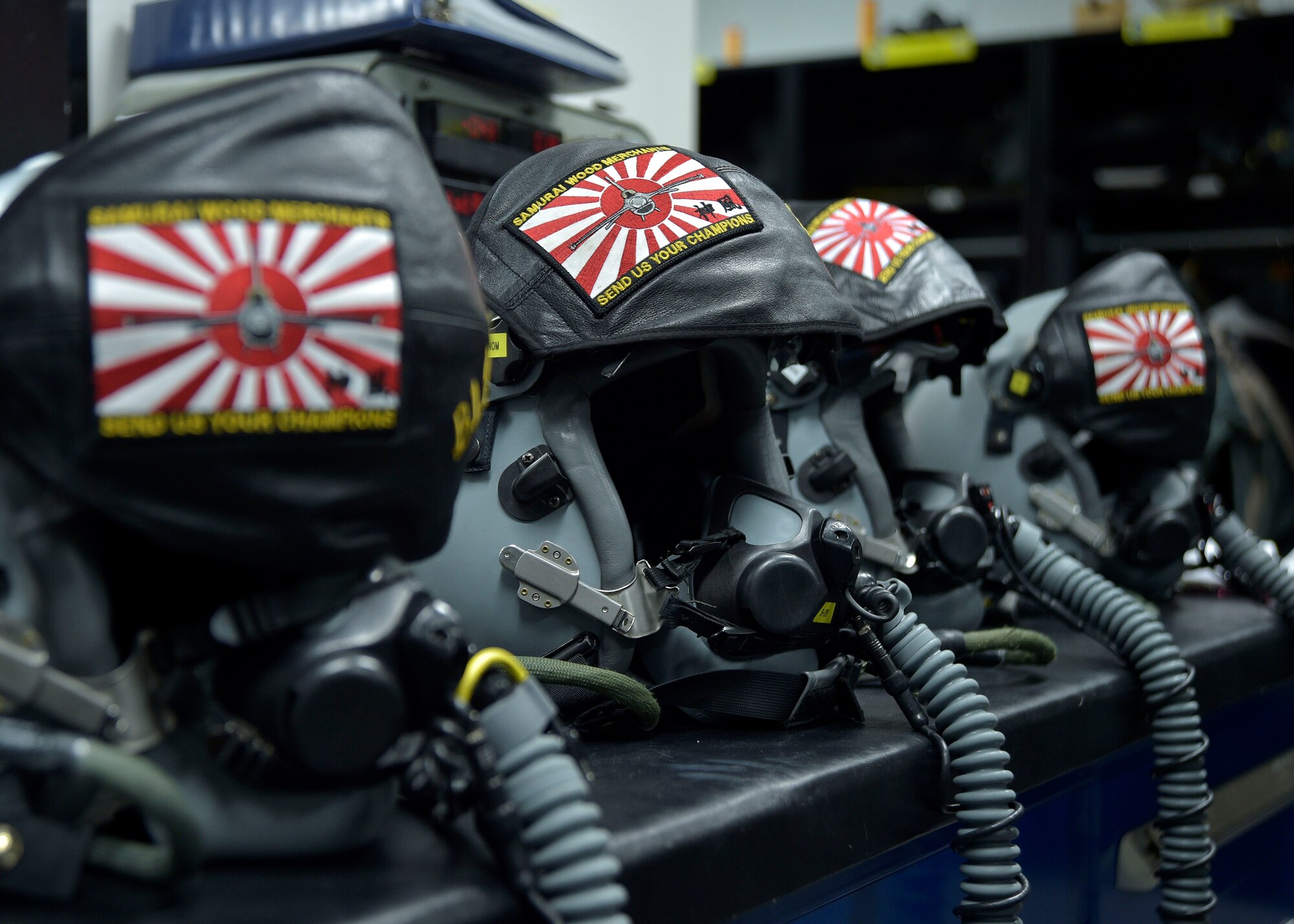 A table full of prepared Joint Helmet Mounted Cueing System helmets and MBU 20/P breathing masks sit in the office of 35th Operations Support Squadron Aircrew Flight Equipment at Misawa Air Base, Japan, March 8, 2016. AFE Airmen conduct pre-checks on all equipment ensuring there are no holes, tears or other discrepancies before the pilots don their gear. The helmet and breathing masks supply oxygen to the pilots while they are flying at high altitudes. (U.S. Air Force photo by Senior Airman Deana Heitzman)