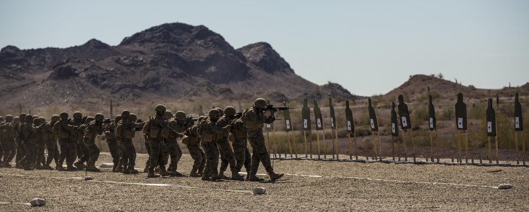 Marines with Marine Wing Support Squadron 371, based out of Marine Corps Air Station Yuma, perform shooting drills with their M16A4 service rifles during a squadron field exercise at the U.S. Army Yuma Proving Ground training facility in Yuma, Ariz., Wednesday, March 9, 2016.