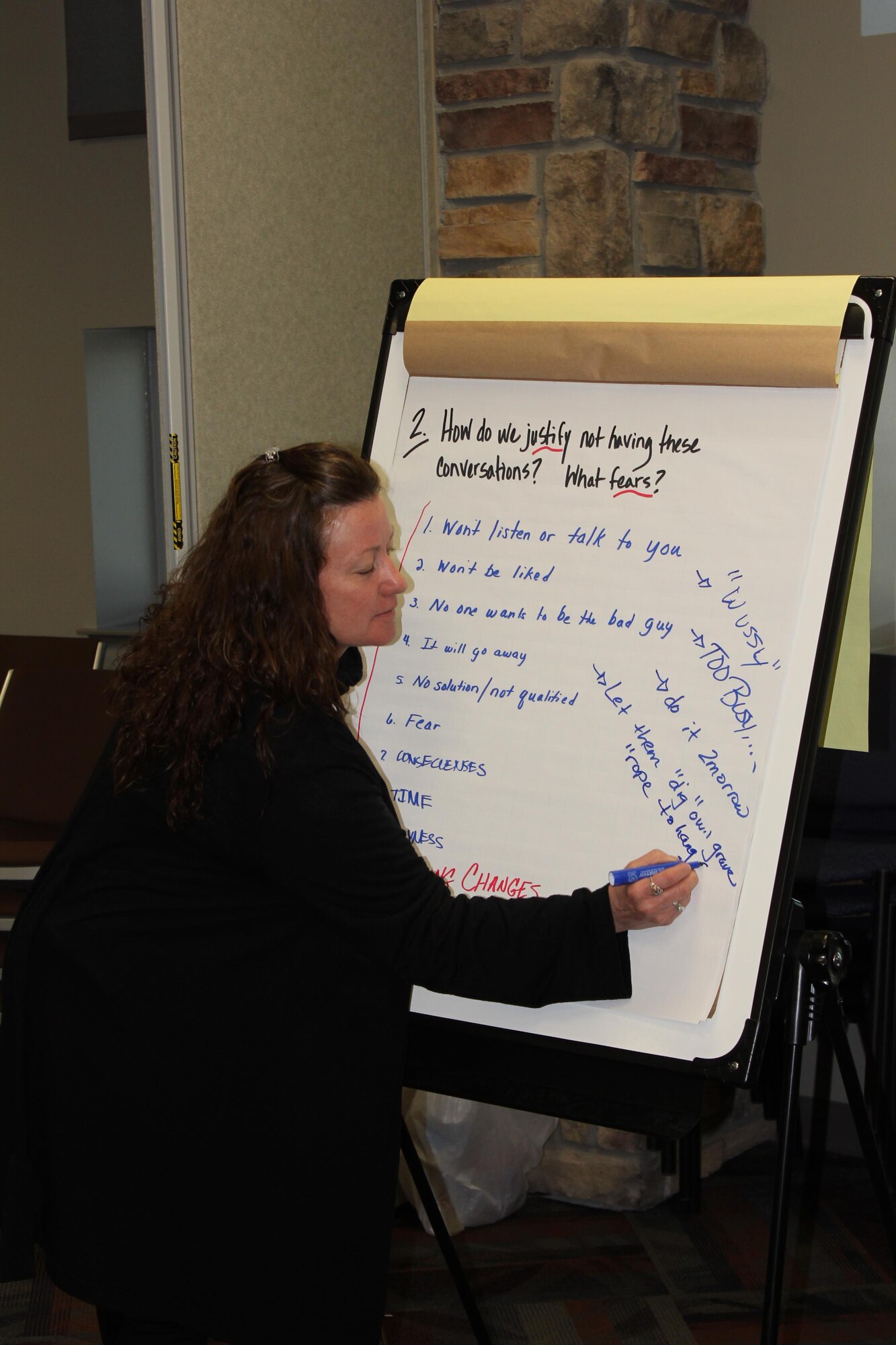 Maj. Susan Murphy, Policy and Procedures Division chief, transcribes key points during a Fierce Conversations class held March 15-16, 2016, at the Air Reserve Personnel Center on Buckley Air Force Base, Colo. Mid-level supervisors from throughout the ARPC gathered for a two-day intensive training course. The course helped managers ensure they are providing information to their subordinates, discerning the core meaning of communications from their subordinates and communicating the strategic vision of leadership in a way that employees can understand and apply. (U.S. Air Force photo/Maj. Heather Newcomb)