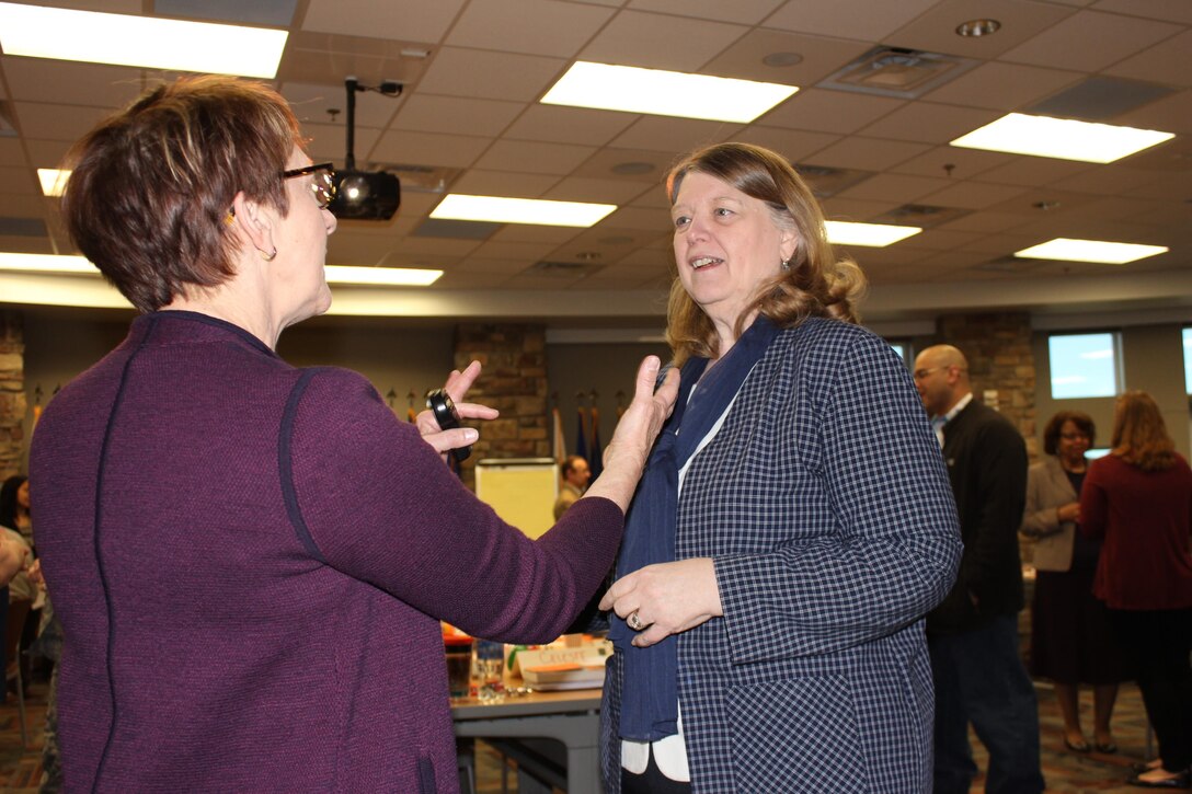 Molly Breazeale, fierce conversations trainer, speaks with Debbie Weule, ARPC retirements chief, during a Fierce Conversations class held March 15-16, 2016, at the Air Reserve Personnel Center on Buckley Air Force Base Colo. Mid-level supervisors from throughout the ARPC gathered for a two-day intensive training course. The course helped managers ensure they are providing information to their subordinates, discerning the core meaning of communications from their subordinates and communicating the strategic vision of leadership in a way that employees can understand and apply. (U.S. Air Force photo/Maj. Heather Newcomb)