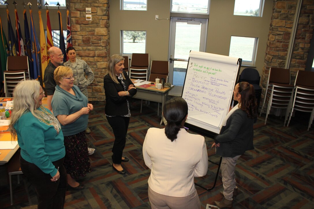 Air Reserve Personnel Center members discuss key points they’ve learned during a Fierce Conversations class held March 15-16, 2016, at ARPC on Buckley Air Force Base, Colo. Mid-level supervisors from throughout the ARPC gathered for a two-day intensive training course. The course helped managers ensure they are providing information to their subordinates, discerning the core meaning of communications from their subordinates and communicating the strategic vision of leadership in a way that employees can understand and apply. (U.S. Air Force photo/Maj. Heather Newcomb)