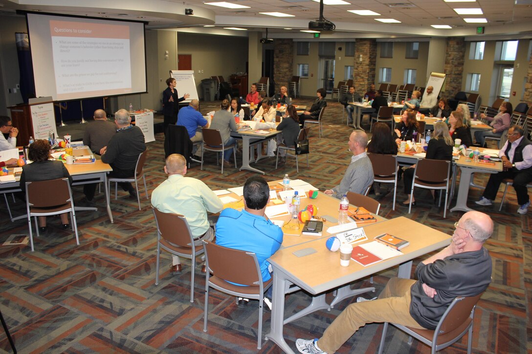 Molly Breazeale, fierce conversations trainer, speaks to the audience during the Fierce Conversations course held March 15-16, 2016, at the Air Reserve Personnel Center on Buckley Air Force Base, Colo. Mid-level supervisors from throughout the ARPC gathered for a two-day intensive training course. The course helped managers ensure they are providing information to their subordinates, discerning the core meaning of communications from their subordinates and communicating the strategic vision of leadership in a way that employees can understand and apply. (U.S. Air Force photo/Maj. Heather Newcomb)