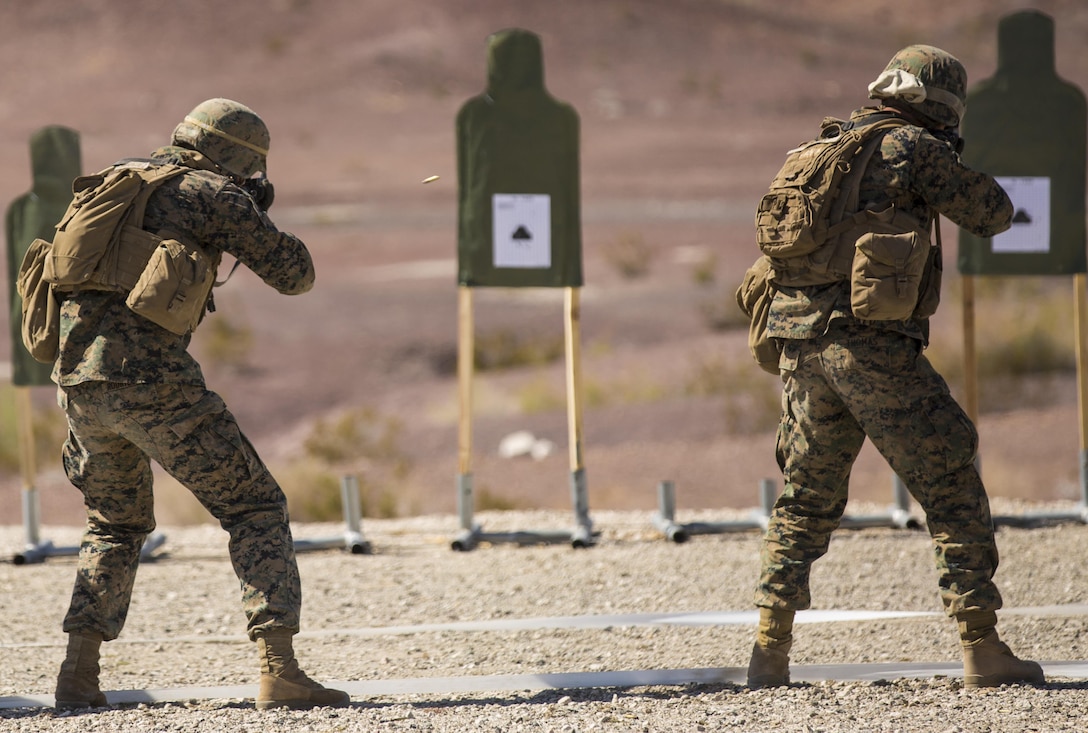 Marines with Marine Wing Support Squadron 371, based out of Marine Corps Air Station Yuma, perform shooting drills with their M16A4 service rifles during a squadron field exercise at the U.S. Army Yuma Proving Ground training facility in Yuma, Ariz., Wednesday, March 9, 2016.