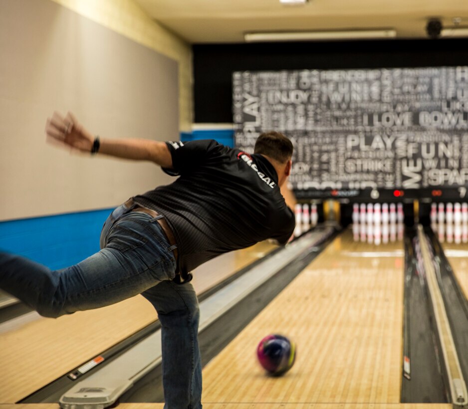 Capt. David Coleman, the aviation safety officer with Headquarters & Headquarters Squadron, stationed out of Marine Corps Air Station Yuma, Ariz., practices his bowling skills at the station bowling alley, Monday, March 14.