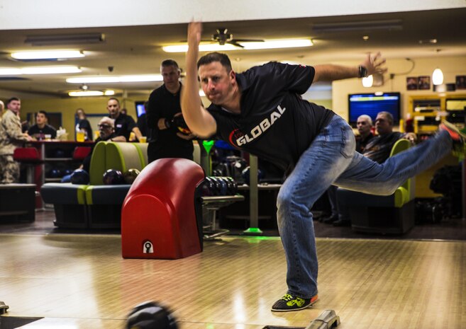 Capt. David Coleman, the aviation safety officer with Headquarters & Headquarters Squadron, stationed out of Marine Corps Air Station Yuma, Ariz., practices his bowling skills at the station bowling alley, Monday, March 14.