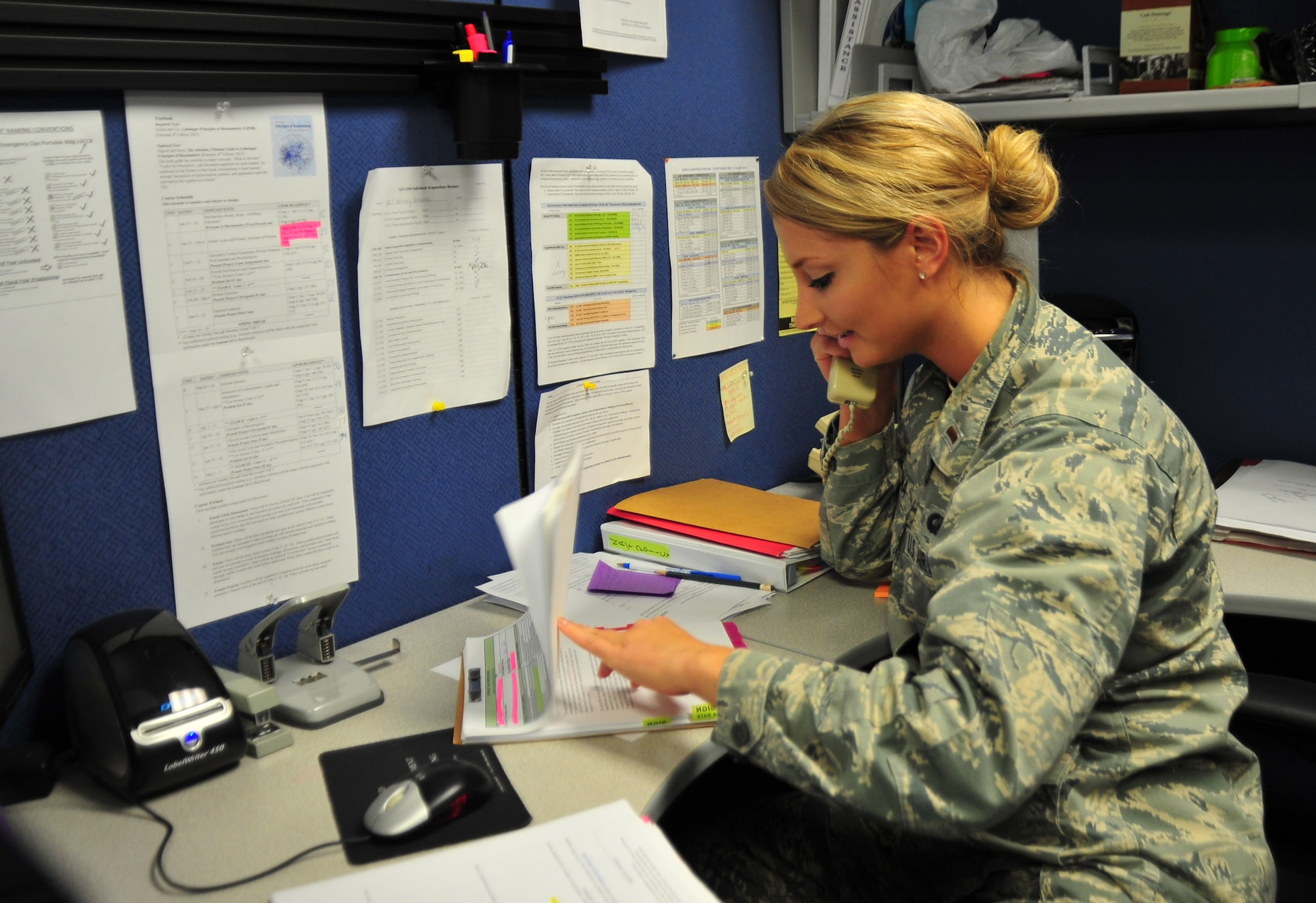 Second Lt. Britney Petrina, 325th Contracting Squadron contract manager, works at her desk March 14 at the 325th CONS. The mission of the squadron is to provide responsive business solutions and acquisition support to Team Tyndall warfighters. (U.S. Air Force photo by Senior Airman Dustin Mullen/Released)