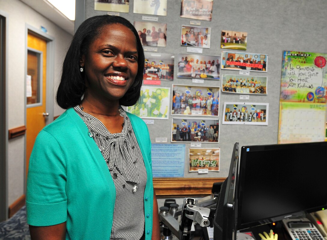 Norma Myers, 325th Contracting Squadron director of business operations, poses for a photo in her office March 16 at the 325th CONS. Myers was chosen to represent the squadron as the Unsung Hero. She has spent nearly 30 years with the squadron, and has helped shape it entirely. (U.S. Air Force photo by Senior Airman Dustin Mullen/Released)