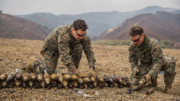U.S. Marines Gunnery Sgt. Jordan Torcello and Staff Sgt. Zachary Rubemeyer, explosive ordnance disposal technicians with the 13th Marine Expeditionary Unit, lay undetonated ordnance for a controlled detonation during Exercise Ssang Yong 16 on Suseongri live-fire range, Pohang, South Korea, March 13, 2016. Ssang Yong is a biennial combined amphibious exercise conducted by U.S. forces with the Republic of Korea Navy and Marine Corps, Australian Army and Royal New Zealand Army Forces in order to strengthen interoperability and working relationships across a wide range of military operations.