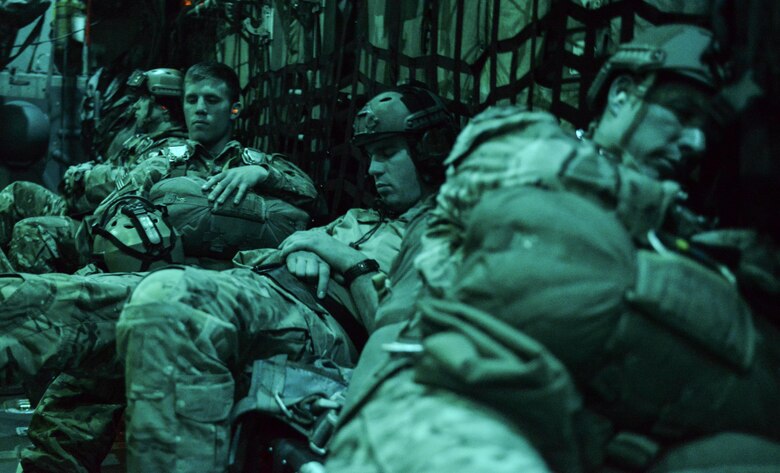 Survival Evasion Resistance Escape specialists rest before making a static line jump out of a C-130 assigned to Dobbins Air Reserve Base, Georgia, over the Nevada Test and Training Range, March 11, 2016. SERE specialists provide state of the art preparation, planning, execution, and adaptation of Personnel Recovery to combatant commanders across the full spectrum of operations by applying Survival, Evasion, Resistance and Escape tactics, techniques, and procedures to enable isolated personnel to "Return With Honor." (U.S. Air Force photo by Airman 1st Class Kevin Tanenbaum)  