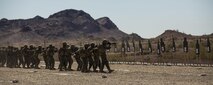 Marines with Marine Wing Support Squadron 371, based out of Marine Corps Air Station Yuma, perform shooting drills with their M16A4 service rifles during a squadron field exercise at the U.S. Army Yuma Proving Ground training facility in Yuma, Ariz., Wednesday, March 9, 2016.