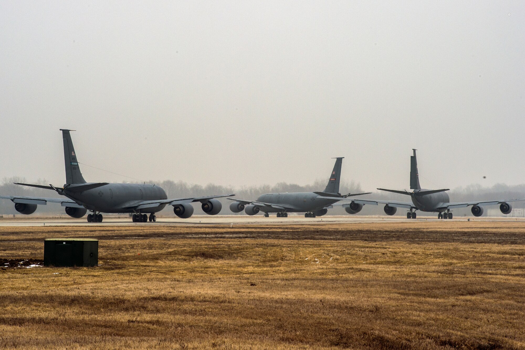 Three KC-135R Stratotankers from a four-ship formation taxi to the runway prior to a flight from Grissom Air Reserve Base, Ind., March 5, 2016. The aircraft departed in 30-second intervals and flew on the same refueling route. (U.S. Air Force photo/Tech. Sgt. Benjamin Mota)