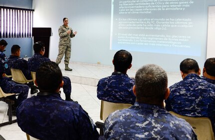 U.S. Air Force Staff Sgt. Karina Cortes, 628th Medical Operations Group medical technician, briefs a group of Salvadoran air force members on how weather can affect an individual’s health during a medical subject matter expert exchange at Ilopango Air Base, El Salvador, March 9, 2016. 12th Air Force (Air Forces Southern) surgeon general’s office, led a five-member team of medics from around the U.S. Air Force on a week-long medical subject matter expert exchange in El Salvador. (U.S. Air Force photo/Tech. Sgt. Heather R. Redman)
